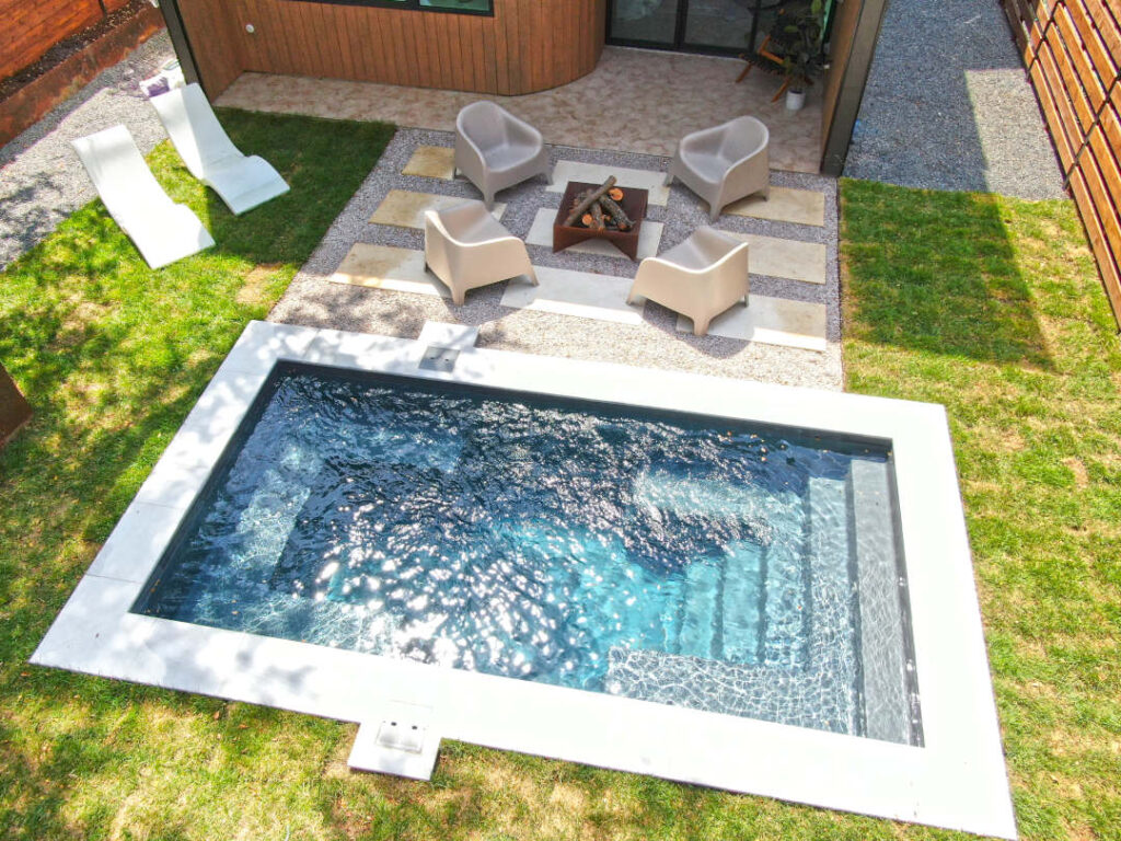 Palladium Plunge 16' (16' x 8') fiberglass swimming pool in Graphite Grey finish.