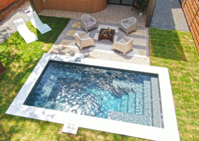 Palladium Plunge 16' (16' x 8') fiberglass swimming pool in Graphite Grey finish.